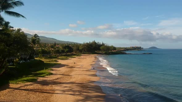 Aerial footage of Kamaole II Beach in the morning.  Maui, Hawaii.