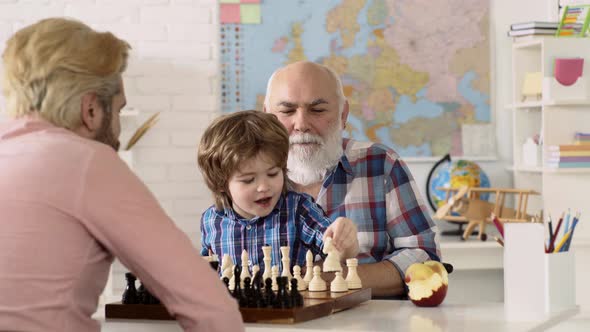 Private School Kids. Grandfather Father and Son Child Boy Playing Chess at Home, Kids Educational