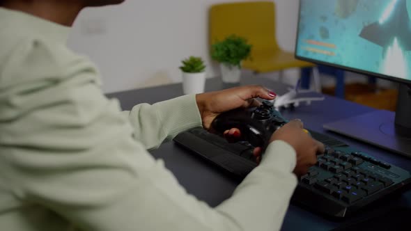 Closeup of Wireless Joystick and RGB Keyboard Pro Video Gamer Playing