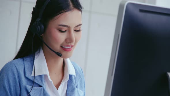 Customer Support Agent or Call Center with Headset Talking to Customer on Phone