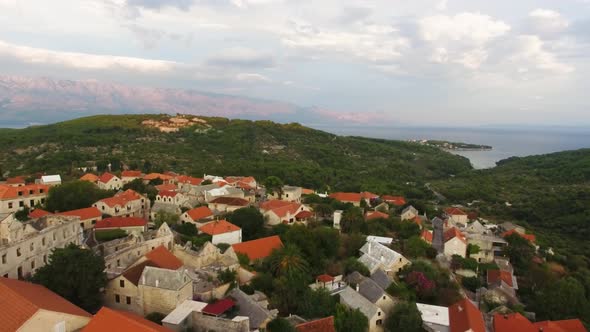 Birds eye view of a small village by the hillside in Sumartin Brac Island Croatia