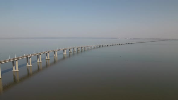 Flying over the longest bridge in Europe - Vasco da Gama in Lisbon, Portugal