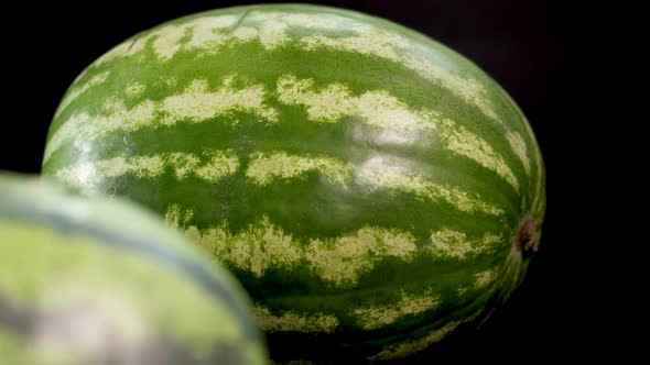 Two Watermelons at Black Background