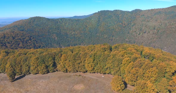 Reveal Shot Of Lake Saint Ann During Autumn In Romania - aerial drone