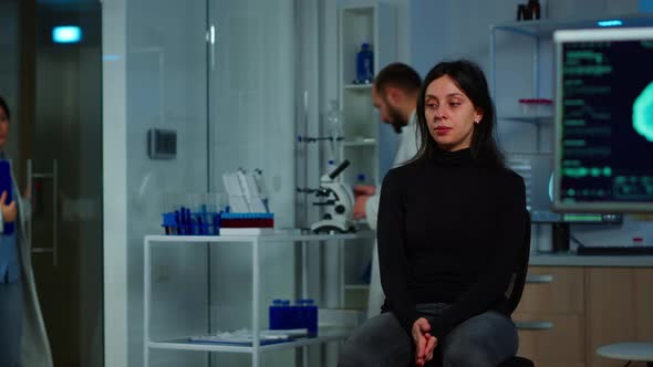 Woman Waiting Doctor Sitting on Chair in Neurological Research Lab