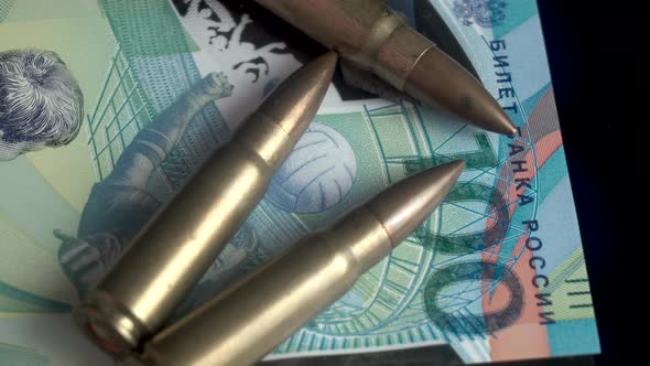Russian Machine Gun Bullets and Ruble Currency Banknote War and Economy Concept