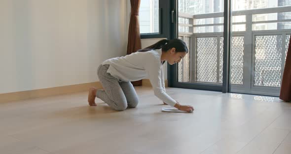 Woman clean the floor at home