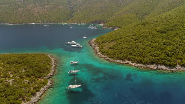 Aerial view of group of boats anchored between islands, Ithaki, Greece.