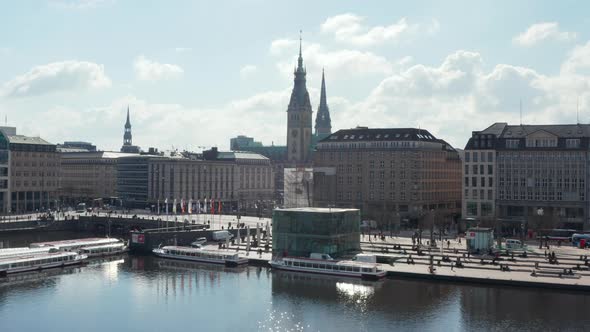 Aerial View of People on the Street By Binnenalster Lake with Hamburg City Hall in the Background