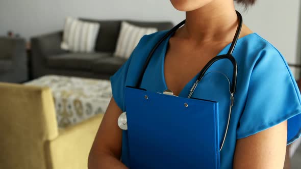 Portrait of female doctor holding a clipboard