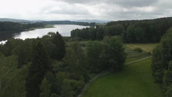 Aerial view over the lake and trees of Bavaria forest