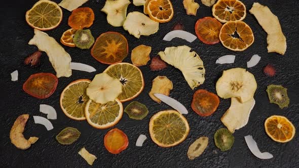 Closeup of Various Sliced Dry Fruits on a Black Background