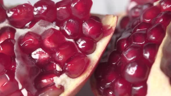 Slice of Pomegranate Seeds on Table Close Up