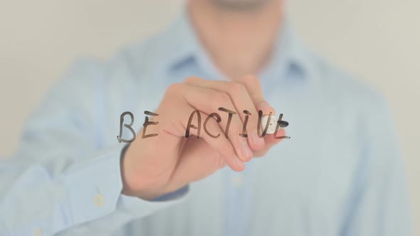 Be Active, Man Writing on Transparent Screen