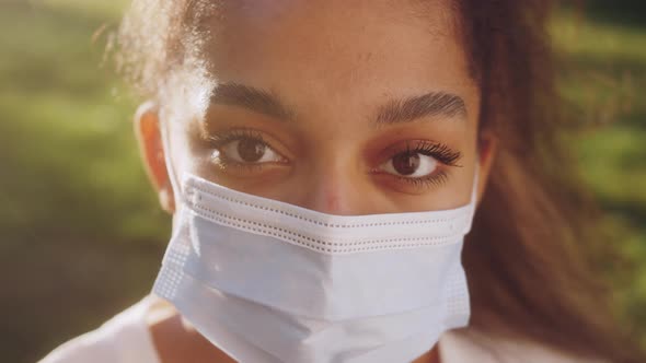 African American Teenage Girl in Medicine Mask During the Covid 19 Close Up