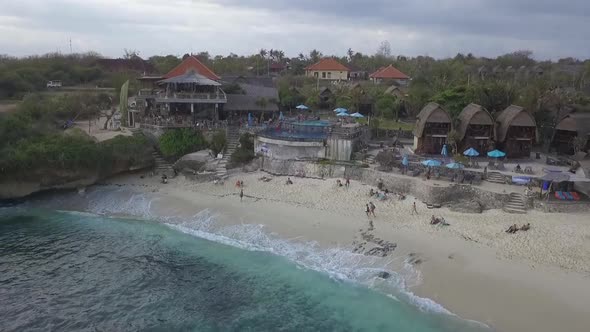 Breathtaking high aerial view flight rising up drone footage ot idyllic dream beach with beachfront