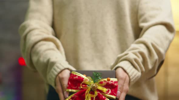 Close Up of Woman Showing Christmas Gift