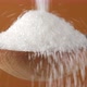 Pouring white sugar in wooden spoon, close up - VideoHive Item for Sale