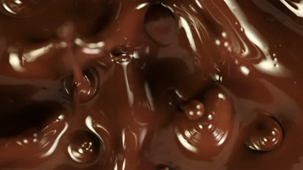 Super Slow Motion Detail Shot of Splashing Melted Chocolate at 1000 Fps