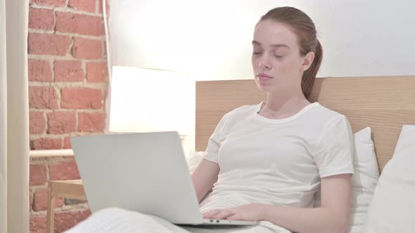 Redhead Young Woman Working on Laptop and Taking Nap