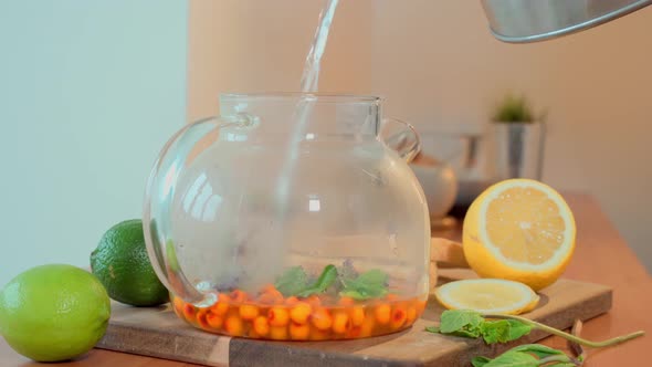 Hot Water is Poured Into a Glass Teapot