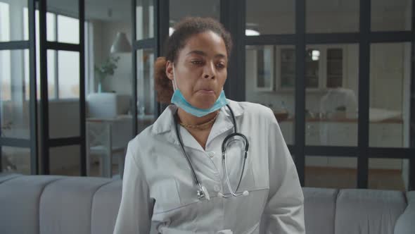 Carefree Female Doctor in Uniform Dancing Happily