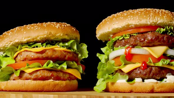 The Concept of American Fast Food. Juicy American Burger with Two Beef Cutlets, with Sauce and