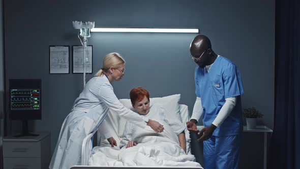 Medics Assisting Woman Getting up