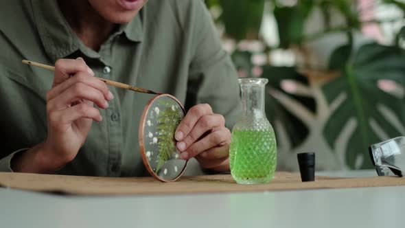 Woman Fixes Glass Plates