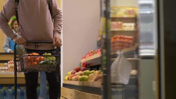 Male Buyer Making Purchases in Grocery Store