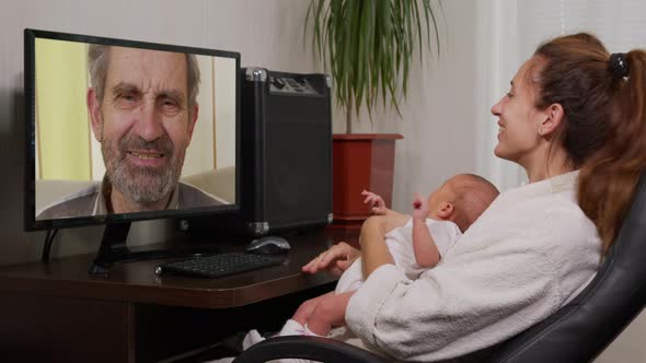 Mother and Baby Having Video Chat Using PC.
