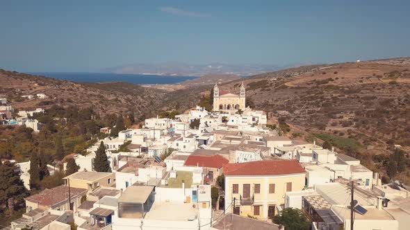 Low Overhead Aerial Drone Shot through the Village of Lefkes Greece Revealing Solar Panels on the Ro