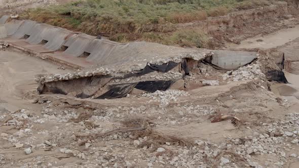 View of flood aftermath as river reroutes around spillway dam in Utah