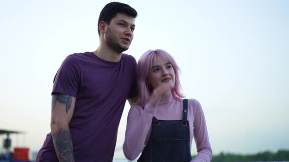 Portrait of Happy Smiling Young Tattooed Boyfriend and Charming Cheerful Girlfriend with Pierced