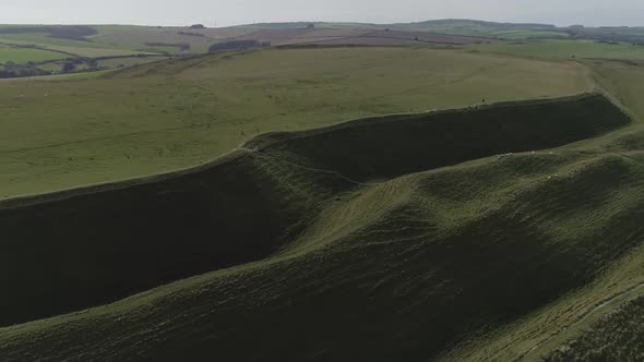 Aerial tracking along the northern side of the iron age hill fort known as Maiden Castle. Three leve