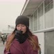 Woman is Drinking Hot Tea or Coffee From a Cup in a Street Wants to Warm Herself in the Winter - VideoHive Item for Sale