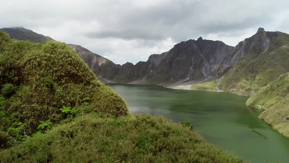 Aerial view of volcanic Lake Pinatubo and mountains, Porac, Philippines.