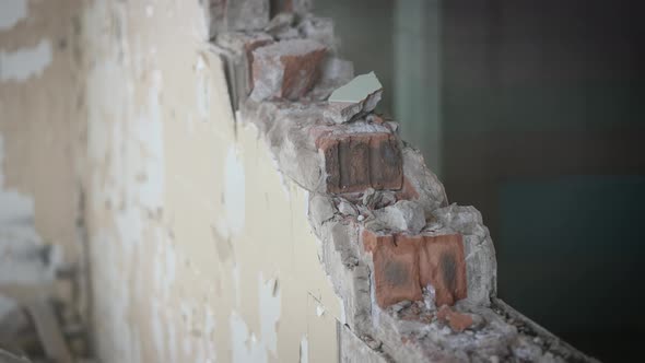 Dismantling an Unnecessary Brick Wall During Construction Work in an Old Building