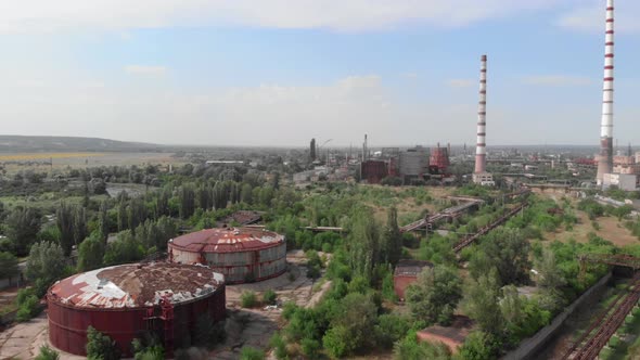 Industrial zone. Industrial plant towers. Factory chimneys. Chemical factory with pipes.