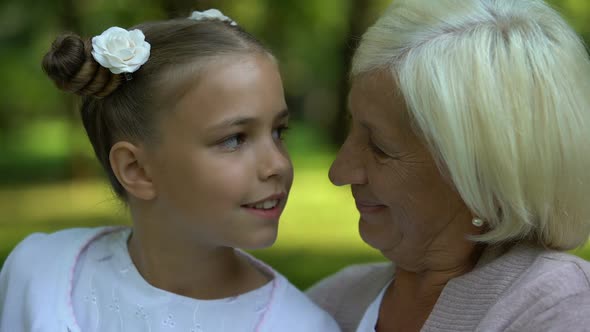 Beautiful Granddaughter and Grandmother Smiling at Camera, Family Values