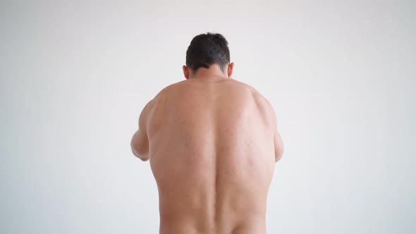 Athletic Man Suffers From Back Pain