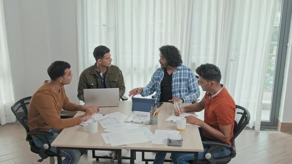 Indian Team of Entrepreneurs Having Discussion in Office