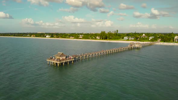 Naples Beach and Fishing Pier at Sunset, Florida.