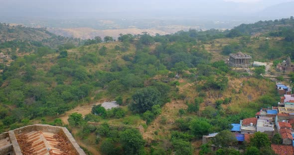 Kumbhalgarh Fort and Indian City Kumbhalgarh Aerial View. Trees and Fortress Ancient Walls on