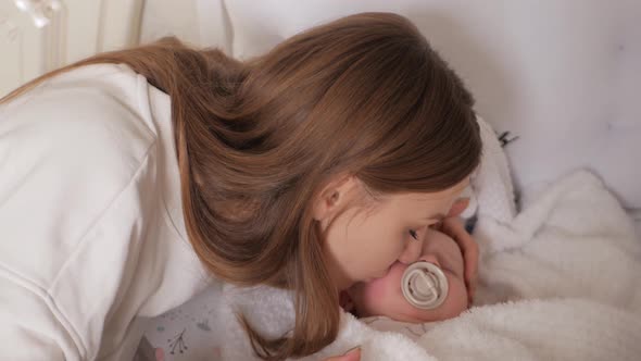 Mom Rocks Baby in Bed Puts Her to Sleep Soothes