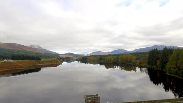 Aerial view of Laggan dam artificial lake and beautiful countryside and wood