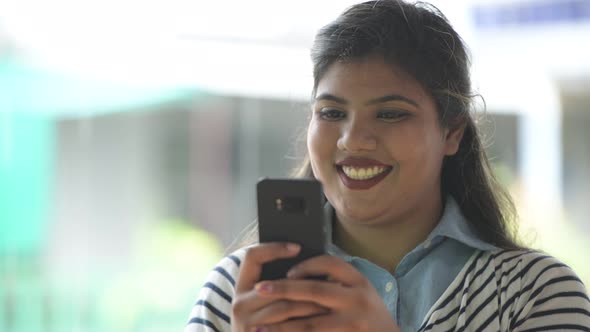 Young Overweight Beautiful Indian Businesswoman in the Streets Outdoors