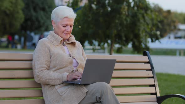 Beautiful Happy Senior Woman Using Laptop Computer Outdoor Middle Aged Businesswoman Typing on