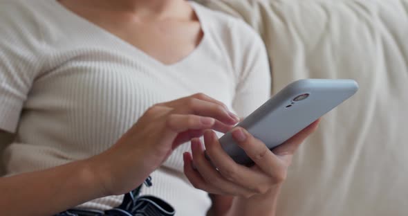 Woman use of smart phone at home