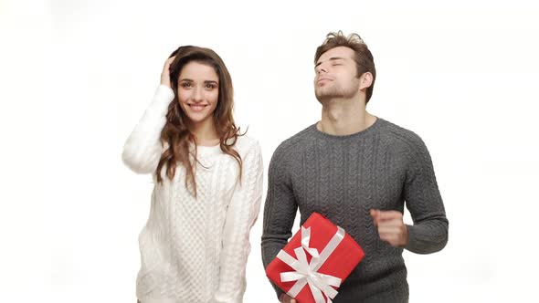  Young Couple in Sweaters Enjoy Dancing Celebrate for Christmas Fun Together Feeling Attraction